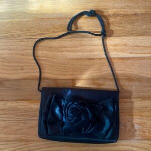 Black evening purse with floral detail